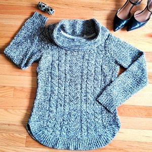Black and white cable knit sweater with loose turtleneck